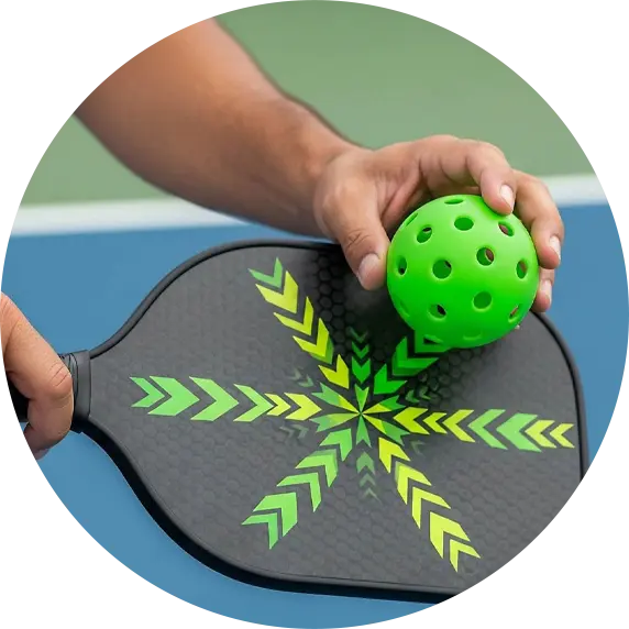 Person holding pickleball racket and ball