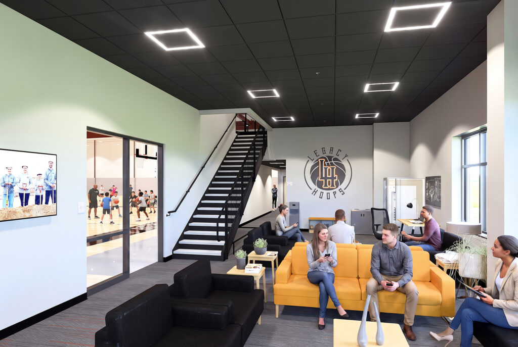 Modern Legacy Hoops lobby with seating areas, facility branding, staircase access, and views into the basketball courts.